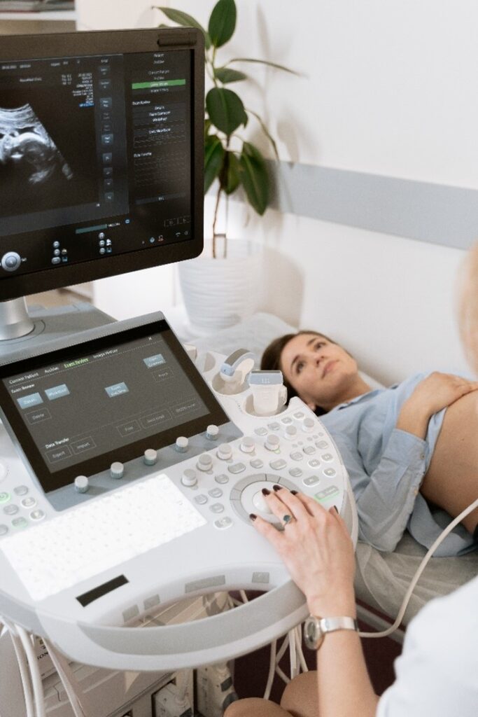 An image of a pregnant mother getting an obstetric scan of baby 